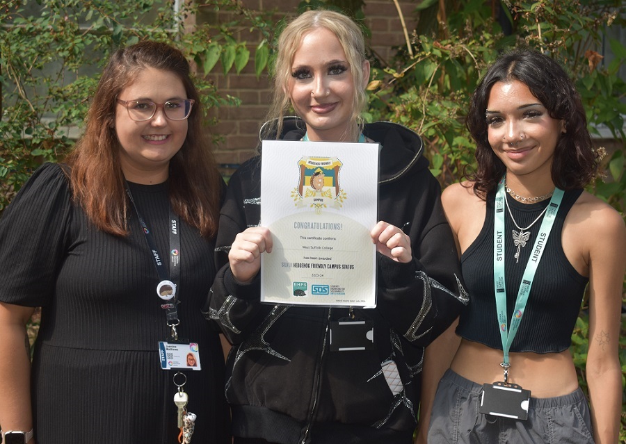 Jasmine Matthews, Sophie Bishop and Naomi Smythe from West Suffolk College - proudly show off their hedgehog friendly campus silver award certificate