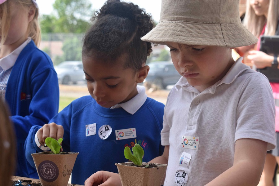 1a two youngsters plant an iceberg lettuce thanks to a link up with Gs Fresh