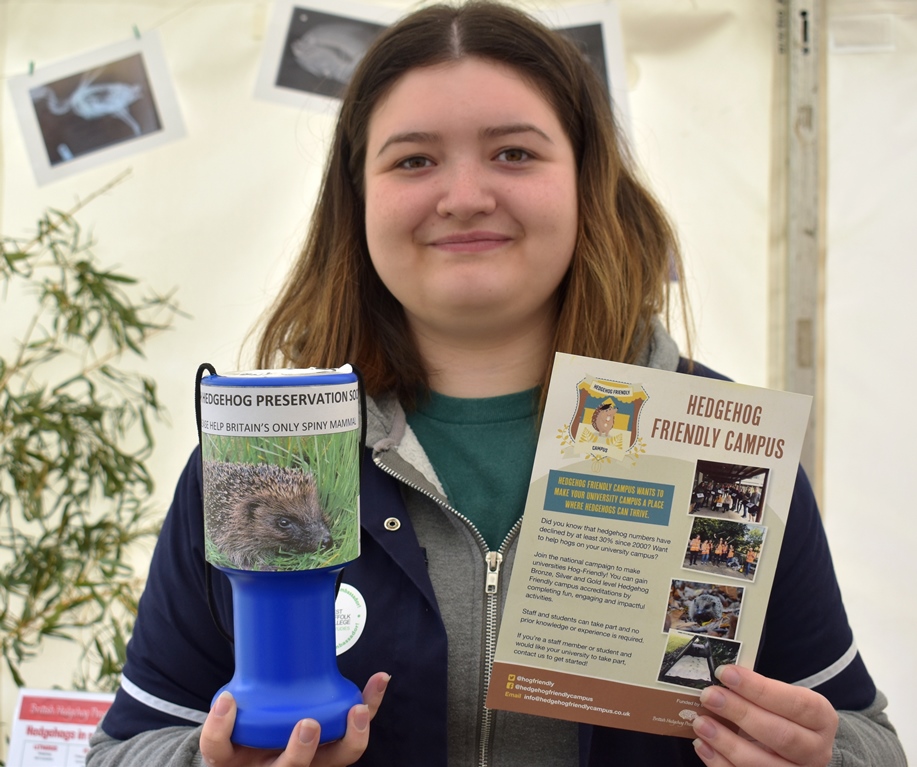 Fundraising for hedgehogs - girl with fundraising pot and information leaflets