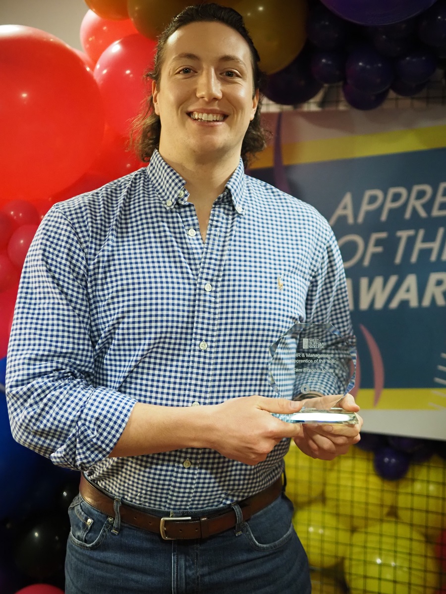 Sam Bragoli-Jones with his Apprenticeship award trophy