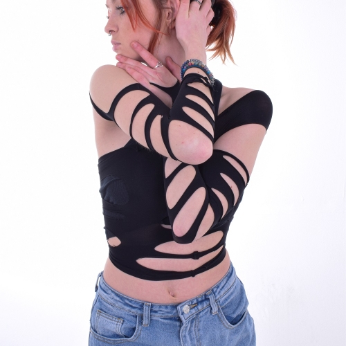 Photo of a female posing with their arms wrapped around them