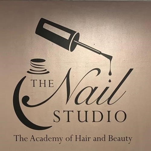 Close up photo of nail studio logo on wall